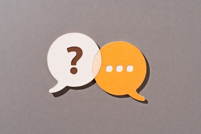 graphic showing question mark and dots indicating a typed reply for help section